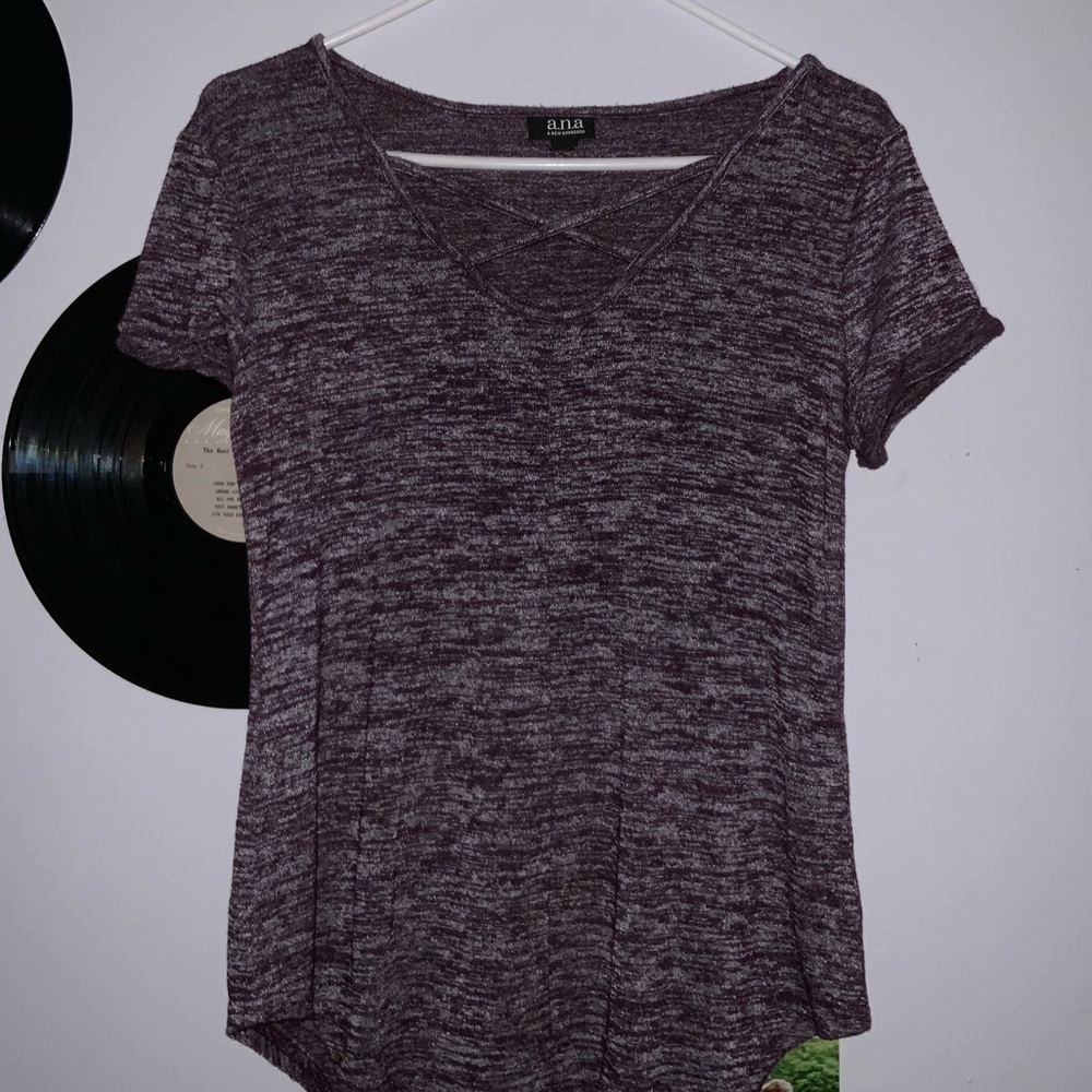Dark purple top with X
